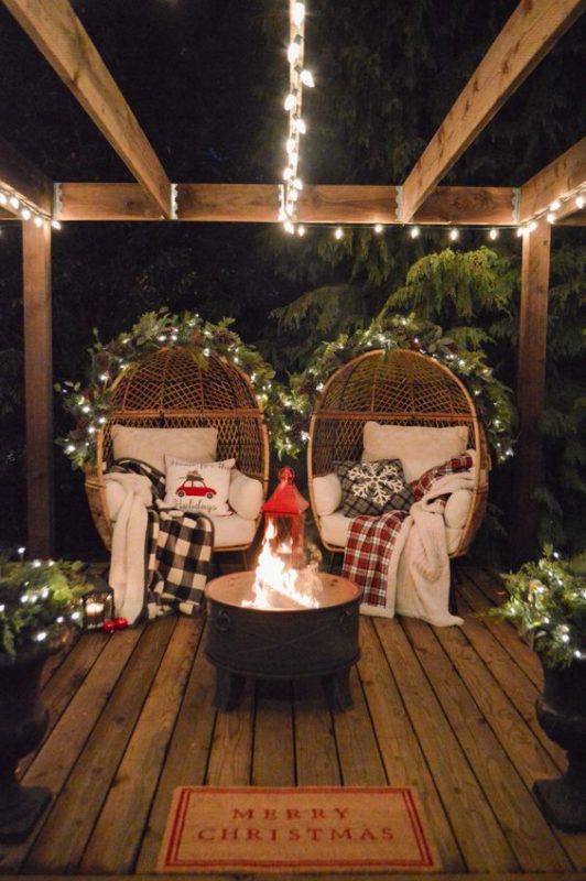 outdoor Christmas decor with cozy fireplace