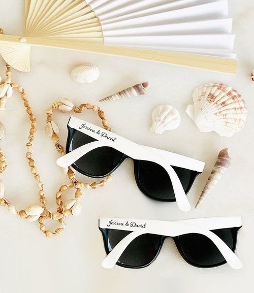 Give Wedding Sunglasses as personalized wedding favors for guests. 
