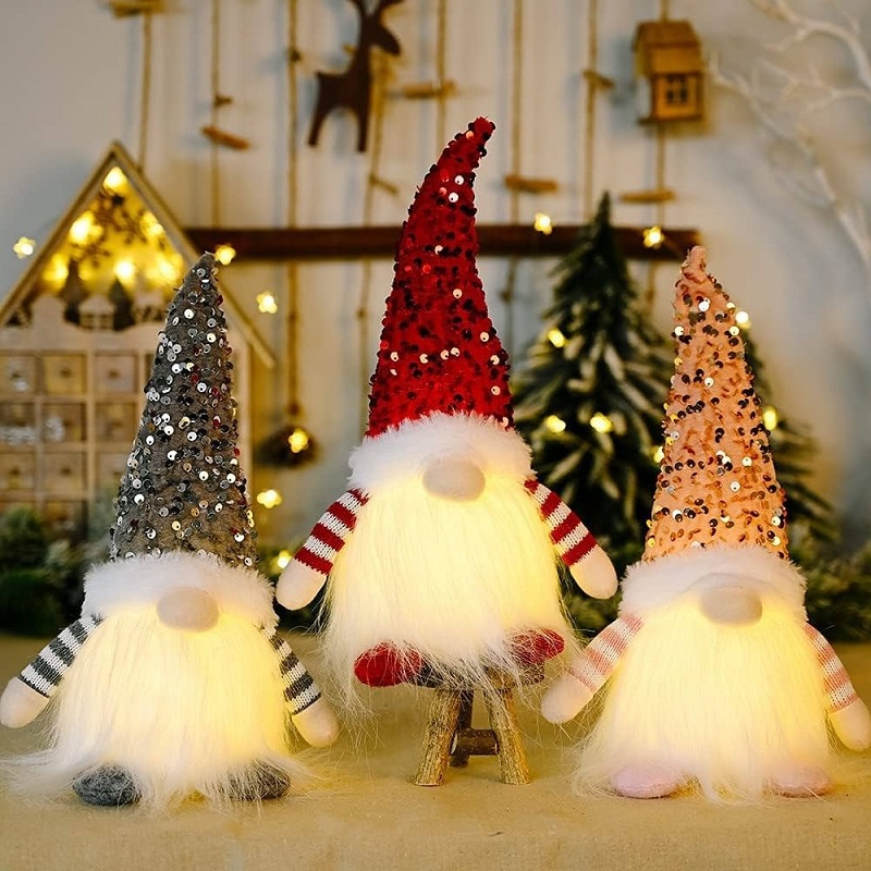 The plush luminous gnome is an impressive Christmas desk decoration. Image via Amazon.
