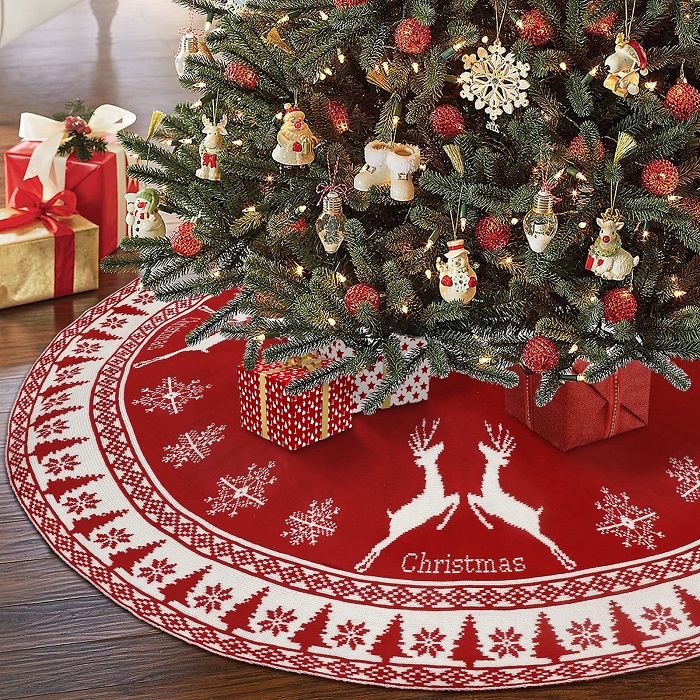 Putting a tree skirt is the final step in the How to Decorate a Christmas Tree guide. Image via Pinterest.