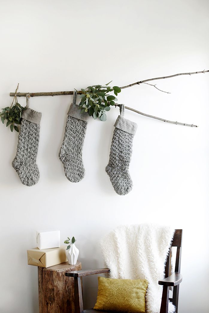 rustic DIY Christmas decorations - Branch Stocking Display: Nature's Mantle