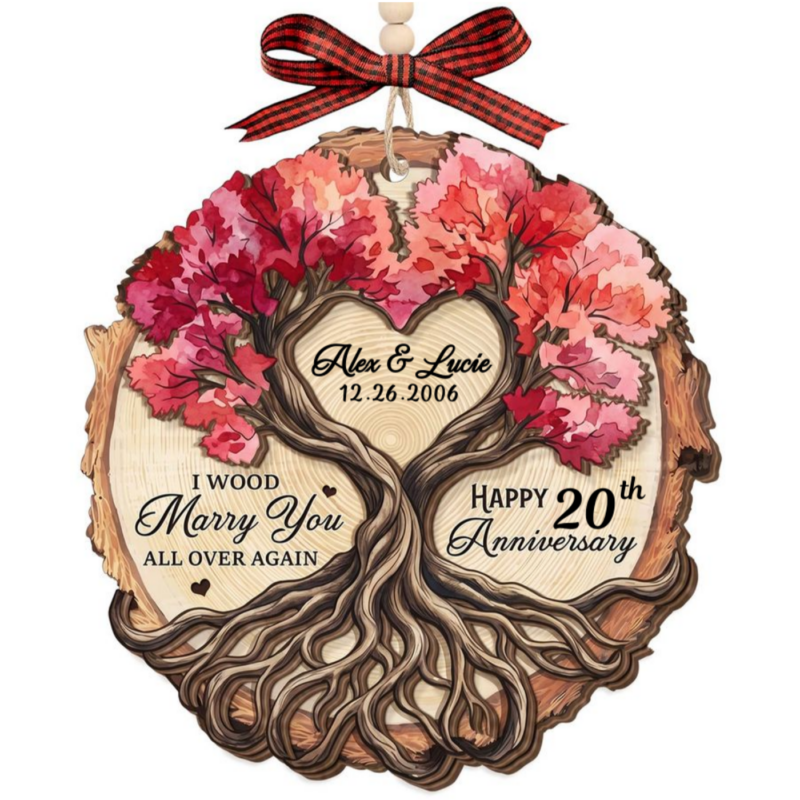 Anniversary gift for couple, an I Wood Marry You All Over Again personalized 2-layered wooden ornament with a heart-shaped tree trunk and pink blooming branches, personalized with "Alex & Helen 09.25.2026" and "Happy 10th Anniversary"